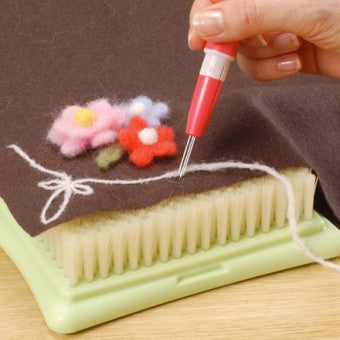 pen-style needle felting tool in use